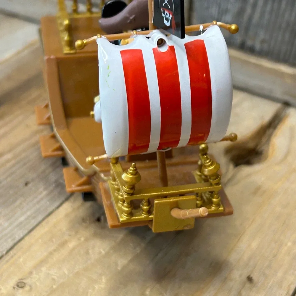 Disney Parks Pirates of the Caribbean Mickey Mouse Pirate Ship Toy Rolling Brown